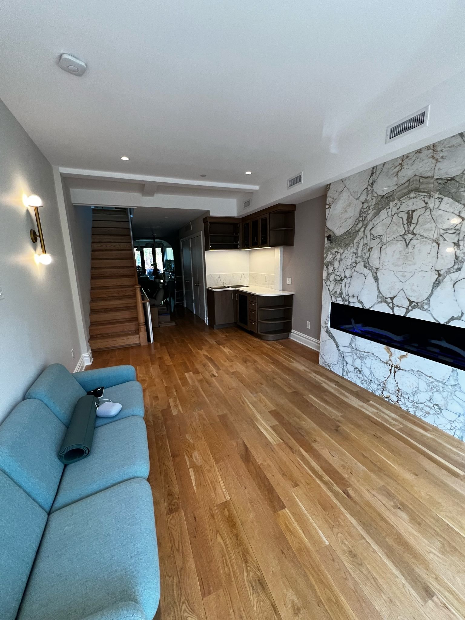 Wet bar and gas fireplace with marble front
