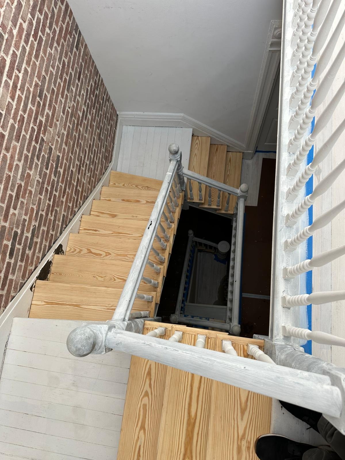 Brick veneer installation to stair wall