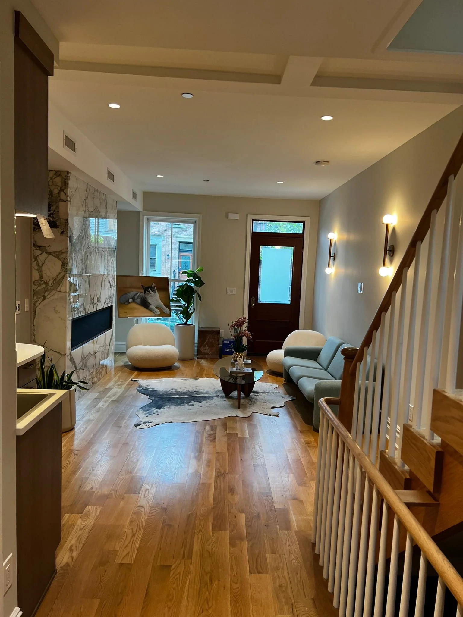 Family room with custom gas fireplace with marble front and new wet bar