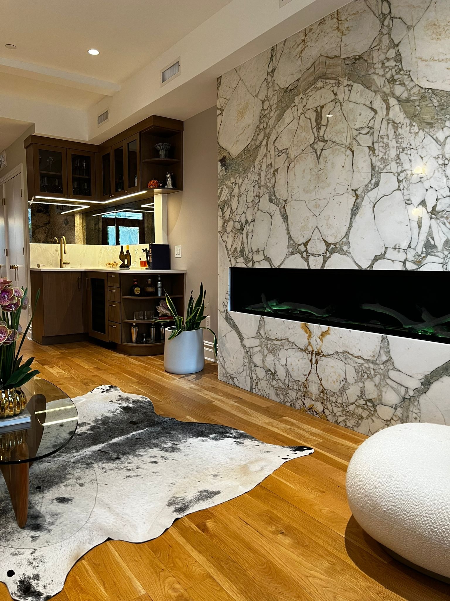 Gas fireplace with marble front and wet bar