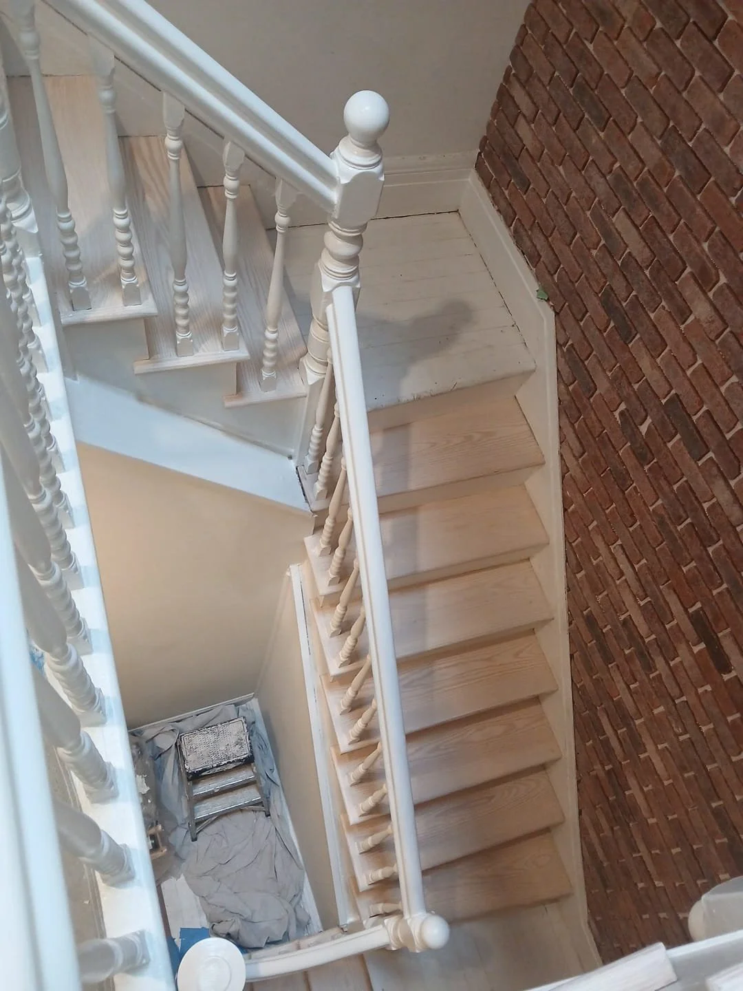 Brick veneer installation to stair wall