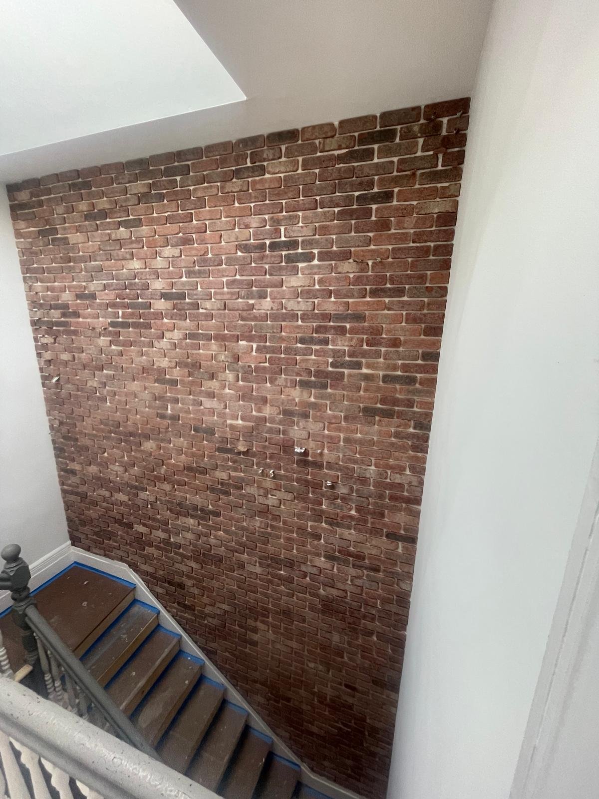 Brick veneer installation to stair wall
