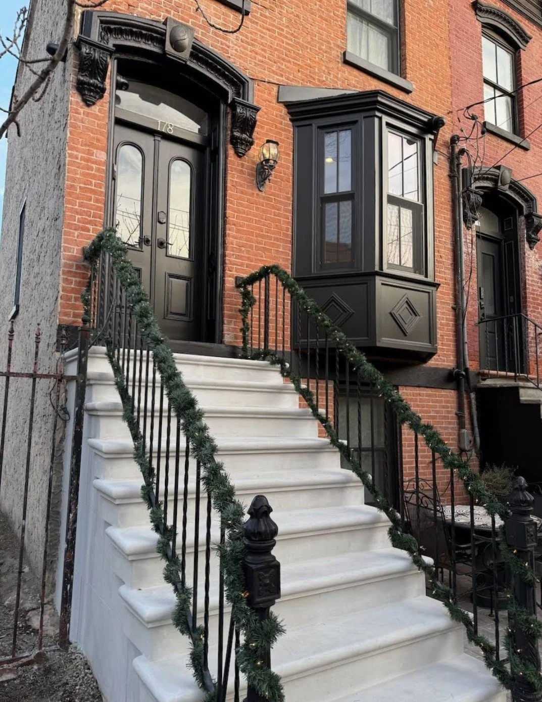 Historic door and bay window replacement with restoration of all original mouldings/trim work