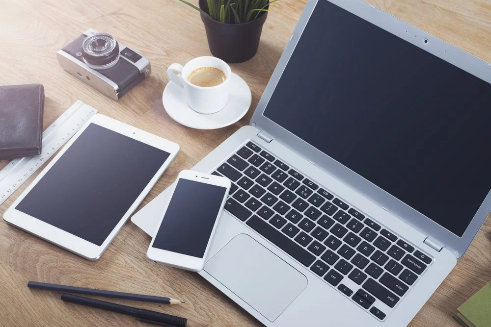 Decorative: laptop, tablet, smart phone with coffee and camera