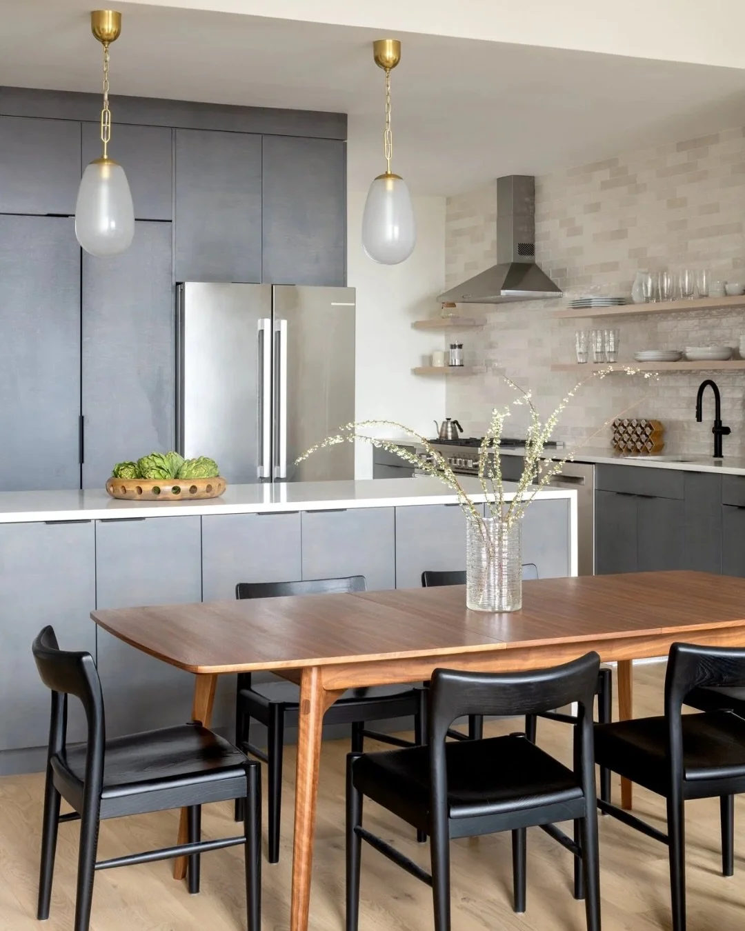 A kitchen that isn&rsquo;t afraid of color. 🖤

These moody cabinets bring so much depth to the space, while the lighter backsplash and countertops keep everything feeling fresh and balanced.

Design: @hco_interiors
Photo: @mcbecks_pix