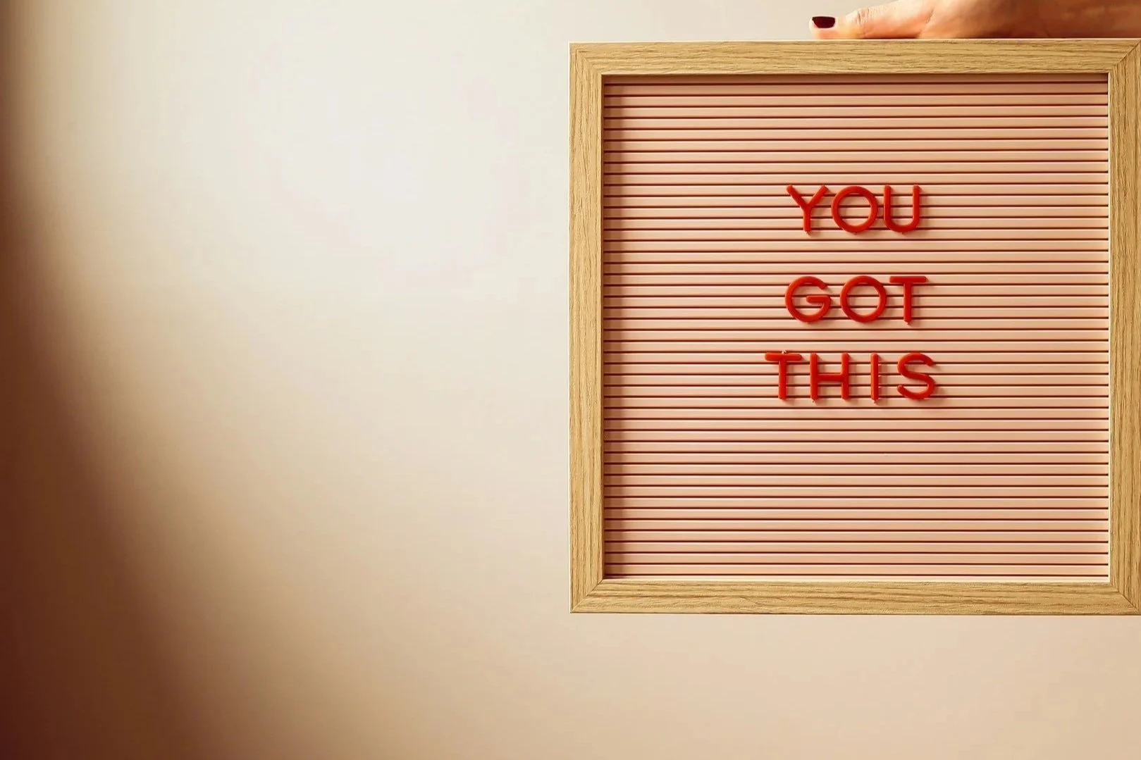 Letter board with a wooden frame displaying the words 'You Got This' in red letters.
