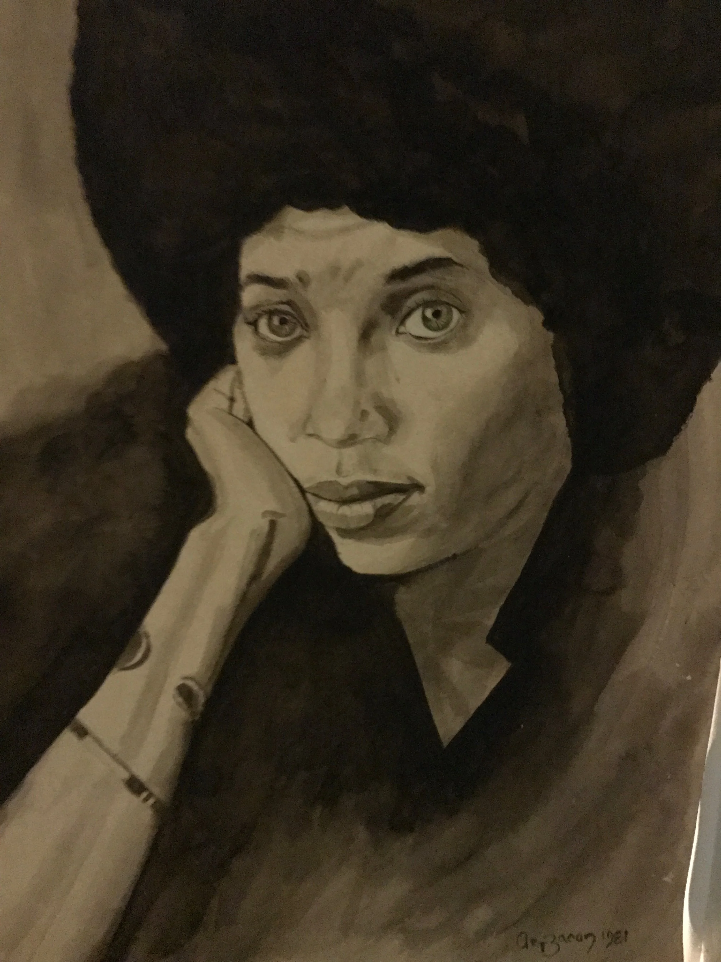 A black and white portrait of a woman with light-colored eyes, resting her face on her hand, with dark hair framing her face.