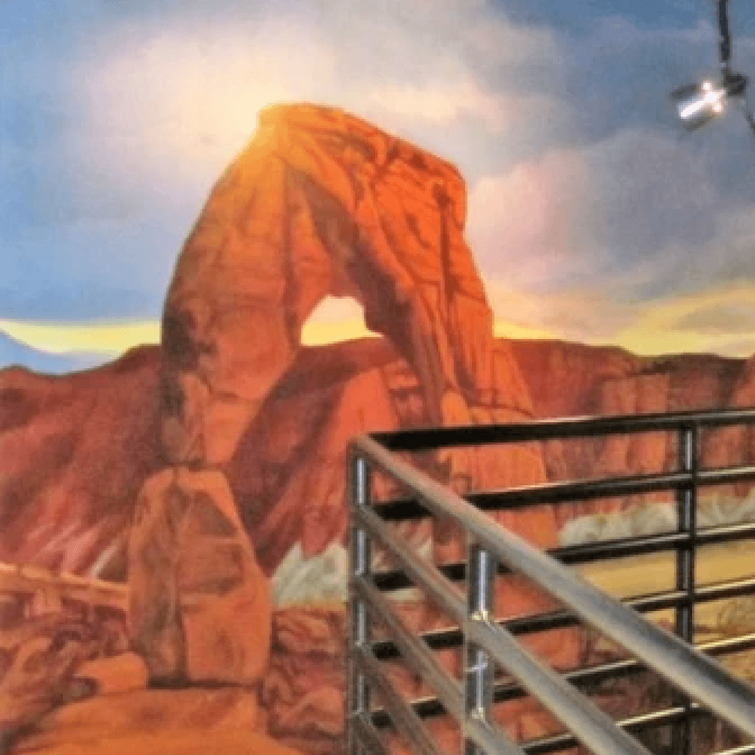 Wall mural depicting the natural rock formation of Arches National Park with a railing in the foreground.