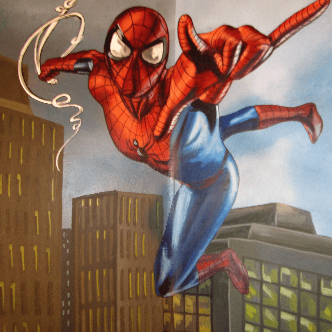 A mural of Spider-Man swinging between buildings.