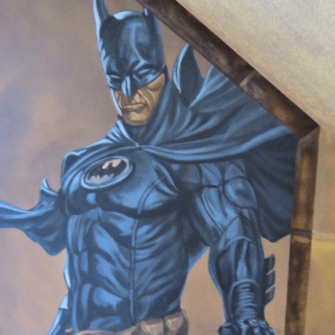 A painting of Batman in a dynamic pose, with his cape flowing, inside a wooden frame.