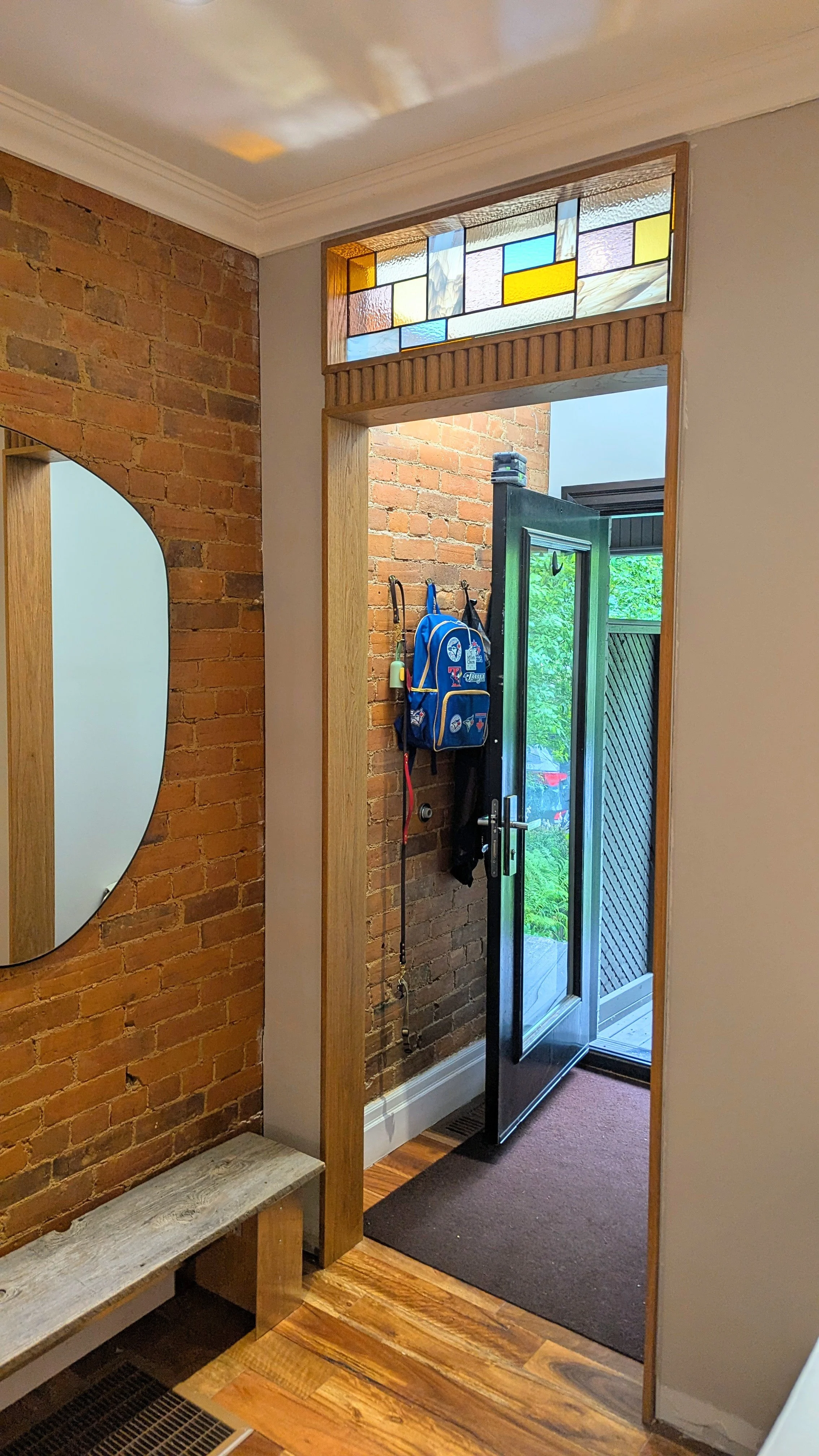 Custom door and window jamb with transom window. 