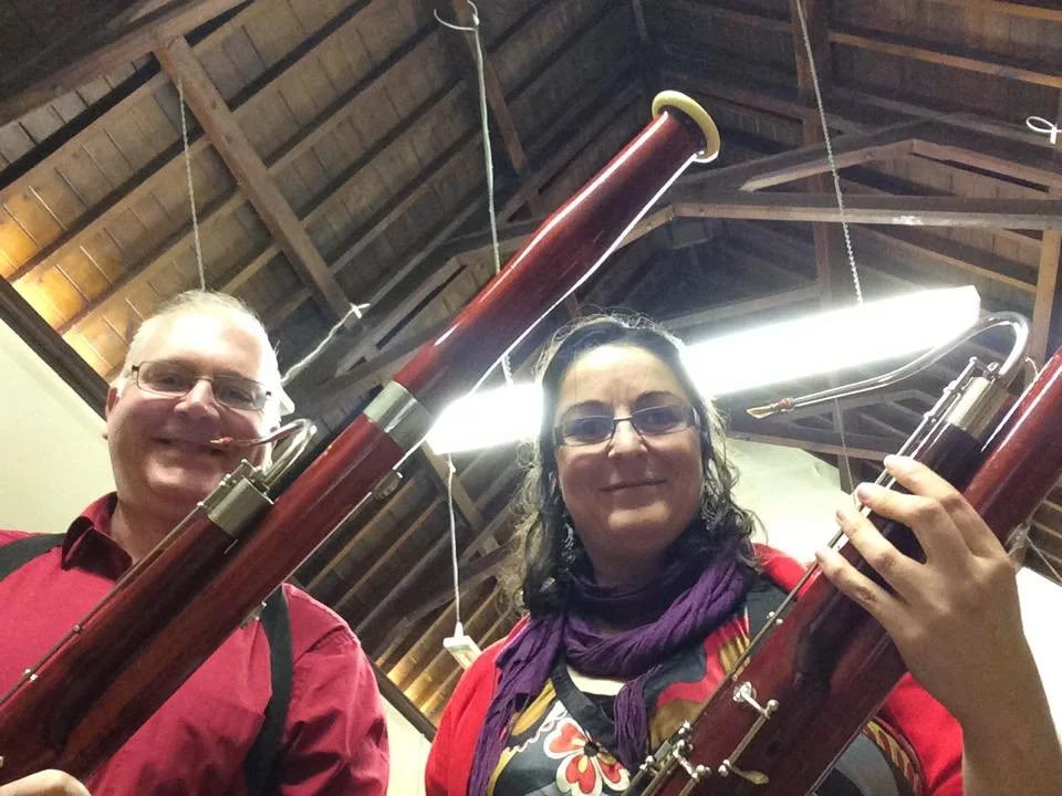 Katy and Miles and bassoons in a barn