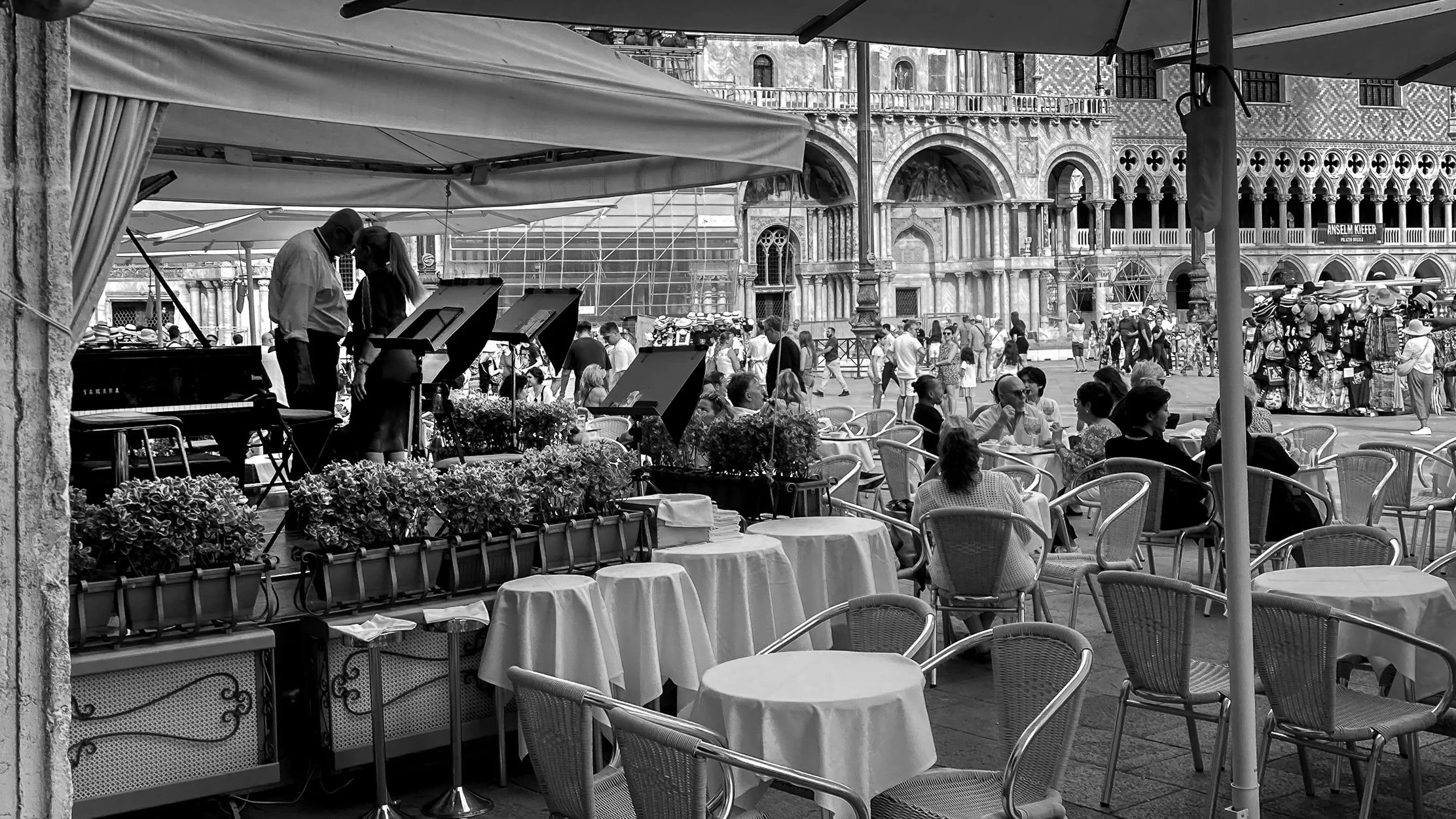 The cafe Lavena band beside tables in St Mark's Square Venice