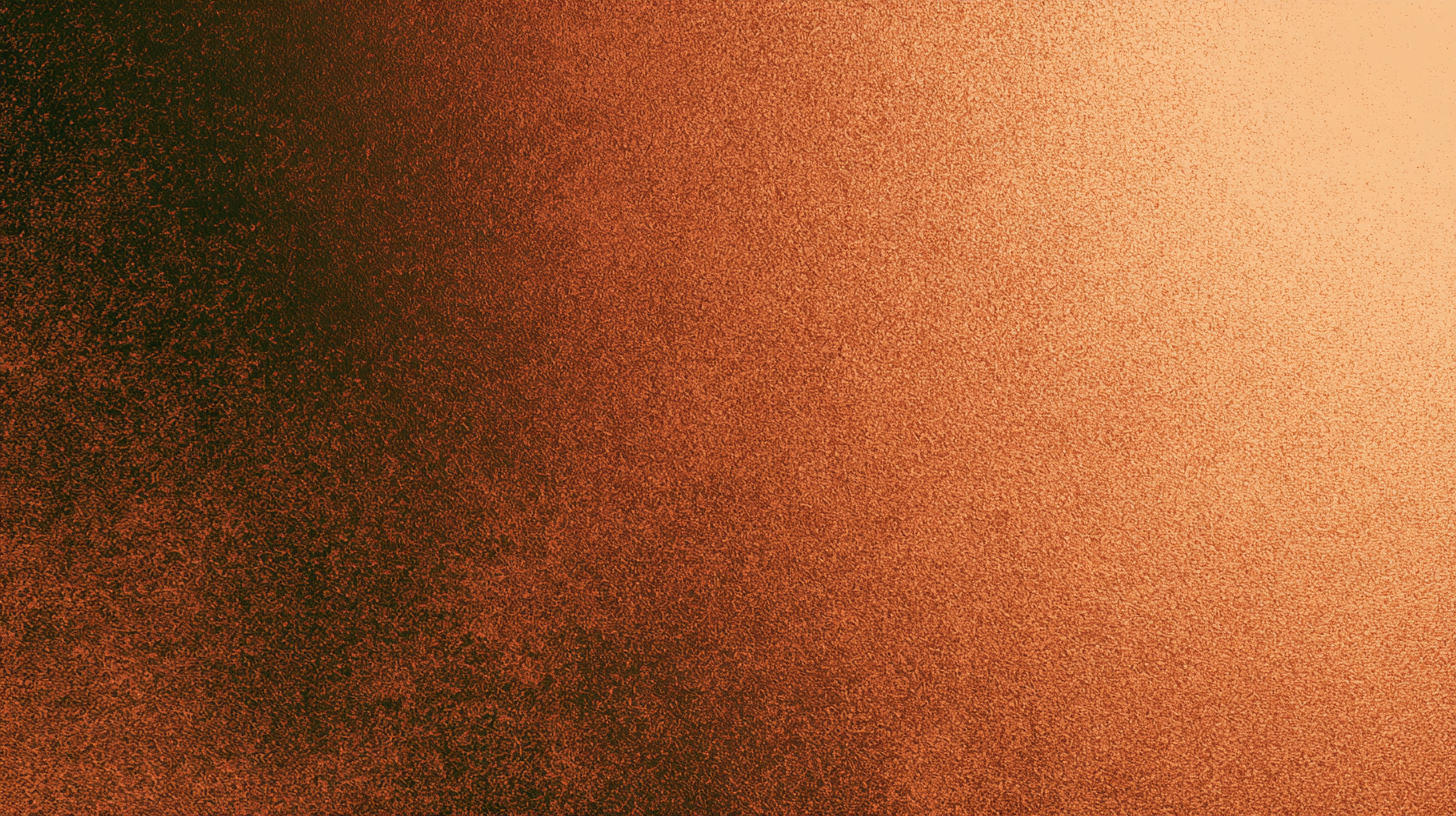 Close-up of a textured surface with gradient colors transitioning from dark reddish-brown on the left to light beige on the right.