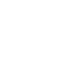 A person sitting at a desk using a laptop