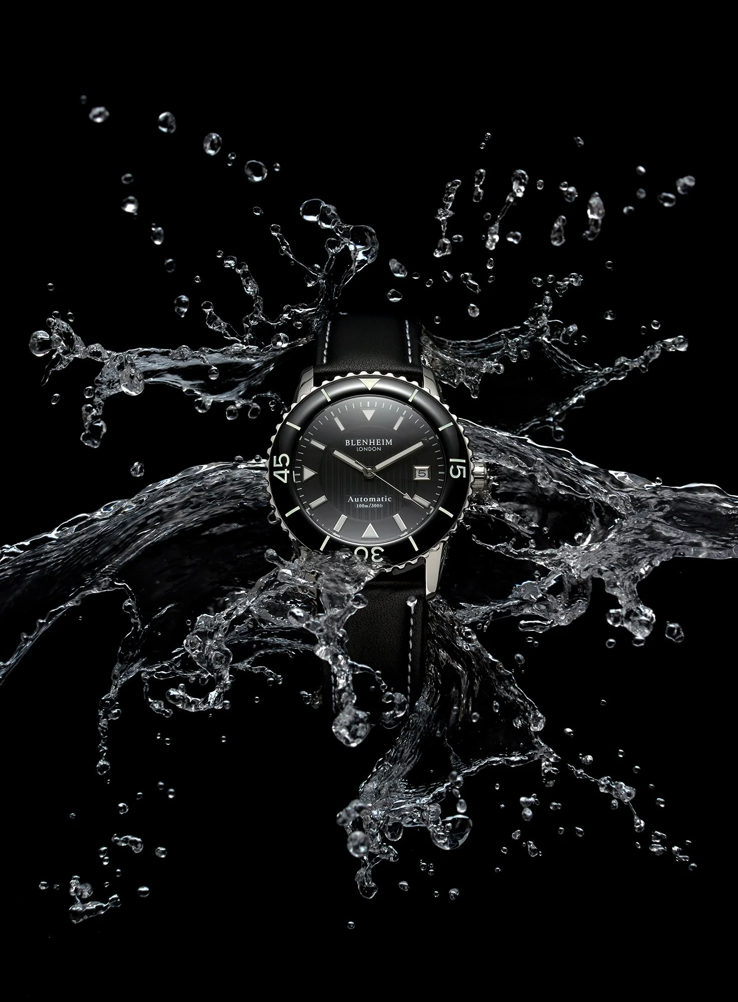 Blenheim Navi Pro watch on black background with splashing water behind