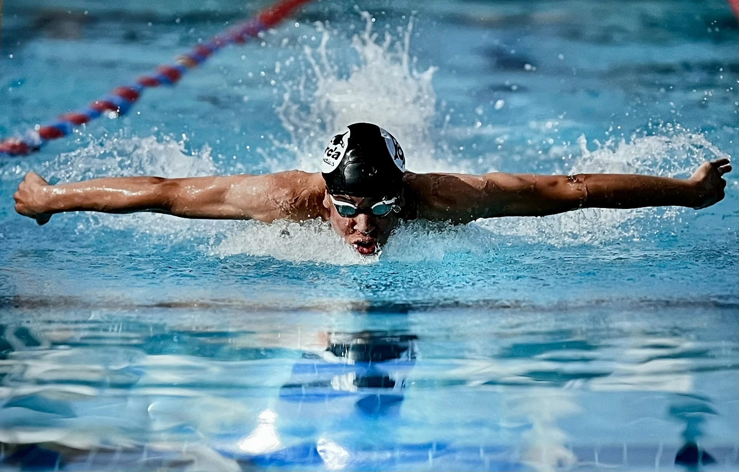 Coach Avery swimming butterfly