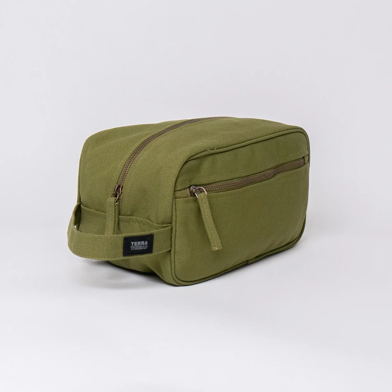 This handsome and earthy canvas toiletry bag from Terra Thread is strong and durable and  made of Fair Trade organic cotton. Has a handle and a lead-free YKK zipper. 