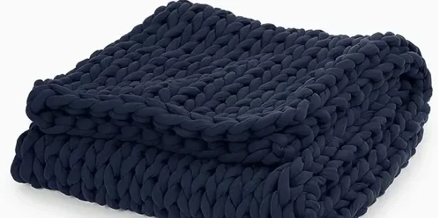 This chunky organic cotton blanket is weighted for a peaceful comfortable sleep. It's hand-knit, breathable and appropriate for all seasons. Great for naps or nighttime sleeping. Machine washable