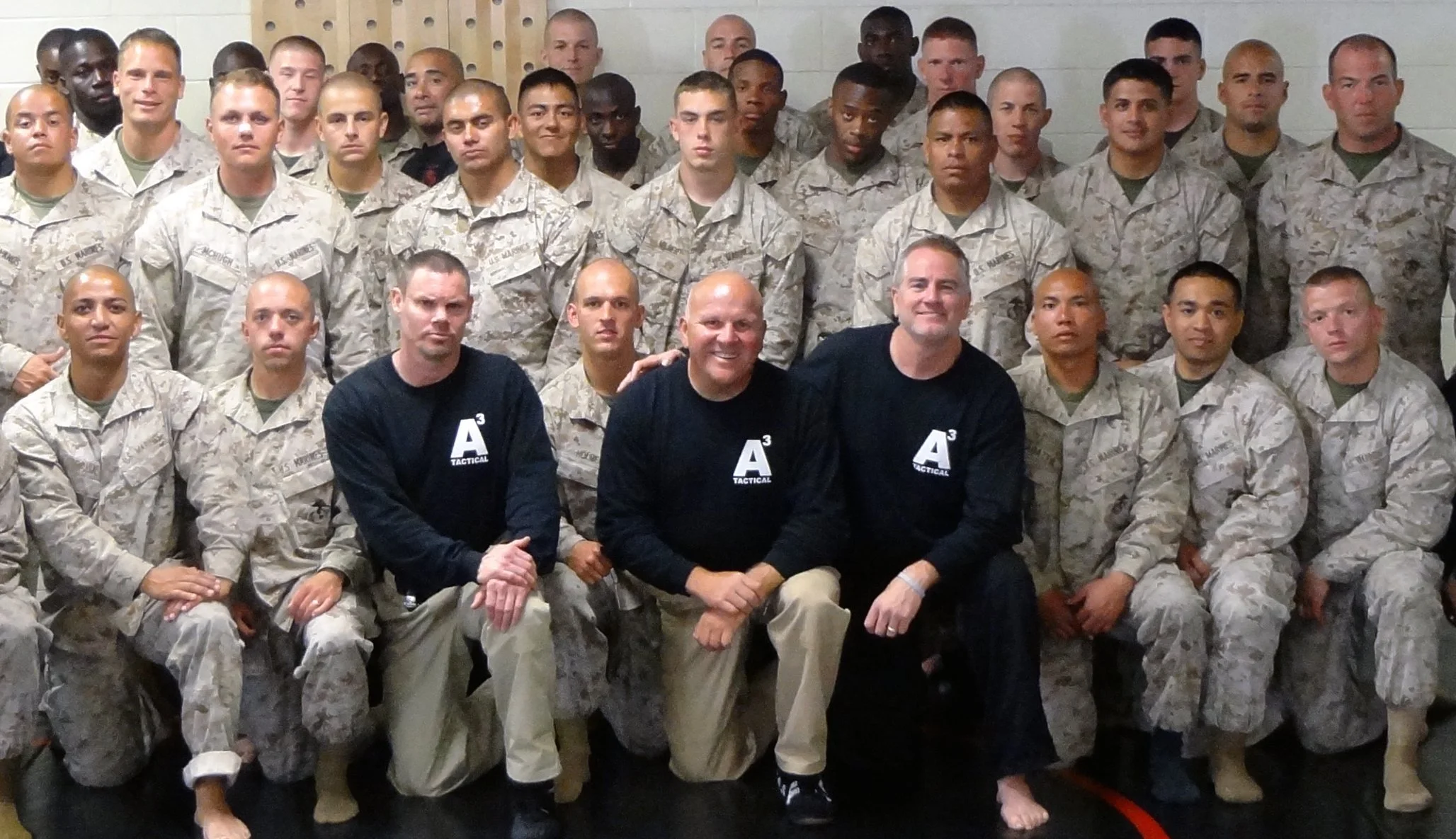 Geoff Meed instructing a platoon of U.S. Marines during a martial arts training course, demonstrating more than 30 years of coaching and instructional experience.