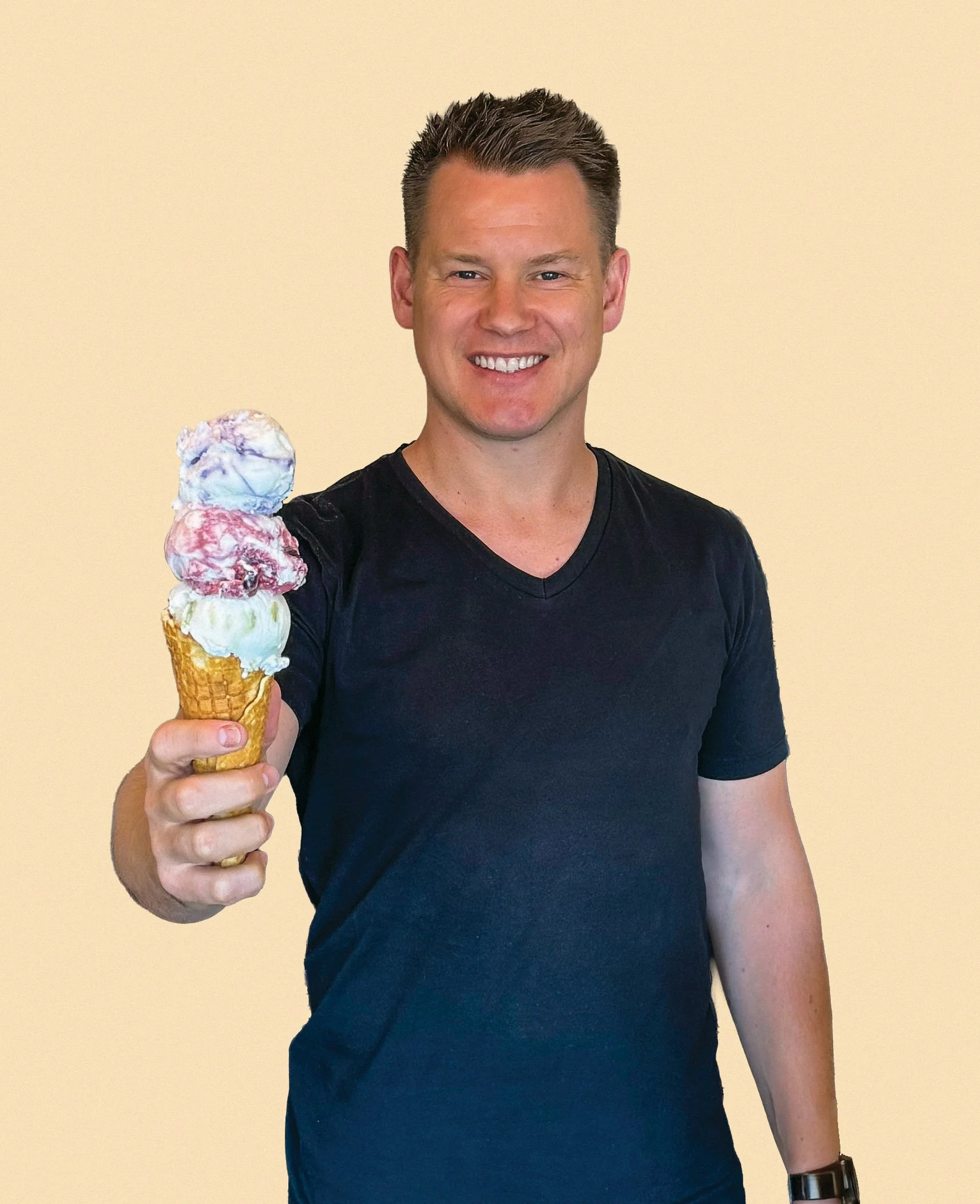 Picture of Sune Stefani smiling holding an ice cream cone with three scoops