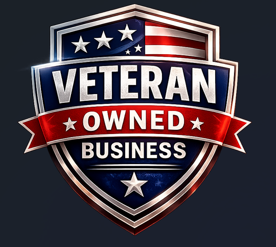 A shield-shaped badge with an American flag design, featuring the words "Veteran Owned Business" in bold white letters on a red banner.
