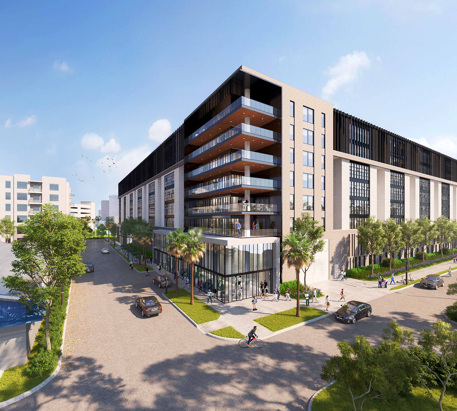 A modern multi-story building with glass balconies, surrounded by trees, with people walking and cars on the street.