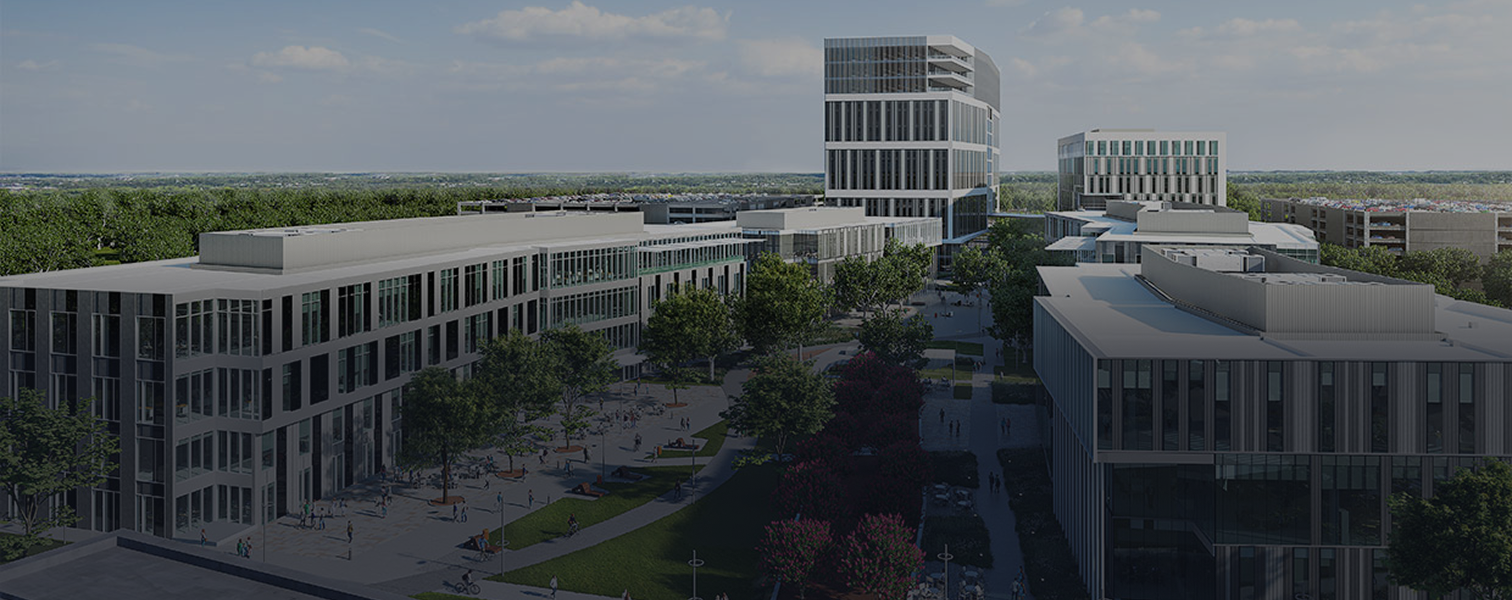 Aerial view of a modern urban campus with contemporary buildings, green trees, and people walking in a plaza.