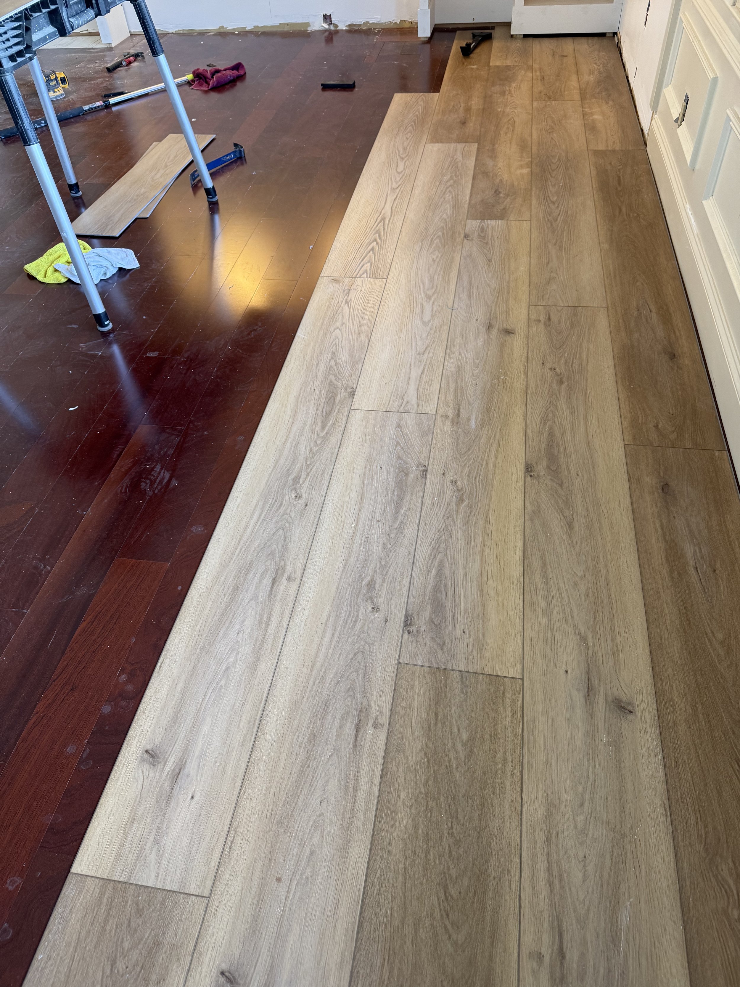 Luxury Vinyl Plank in bedroom being installed