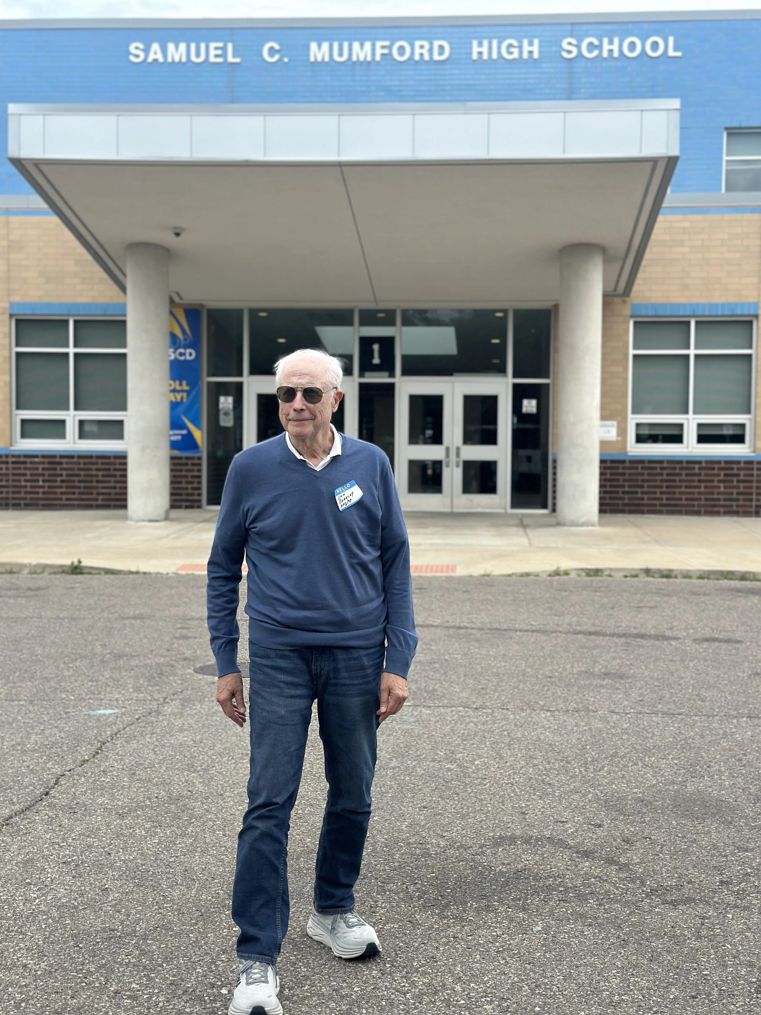 Daniel standing at the entrance of Samuel C. Mumford High School - set of Beverly Hills Cop