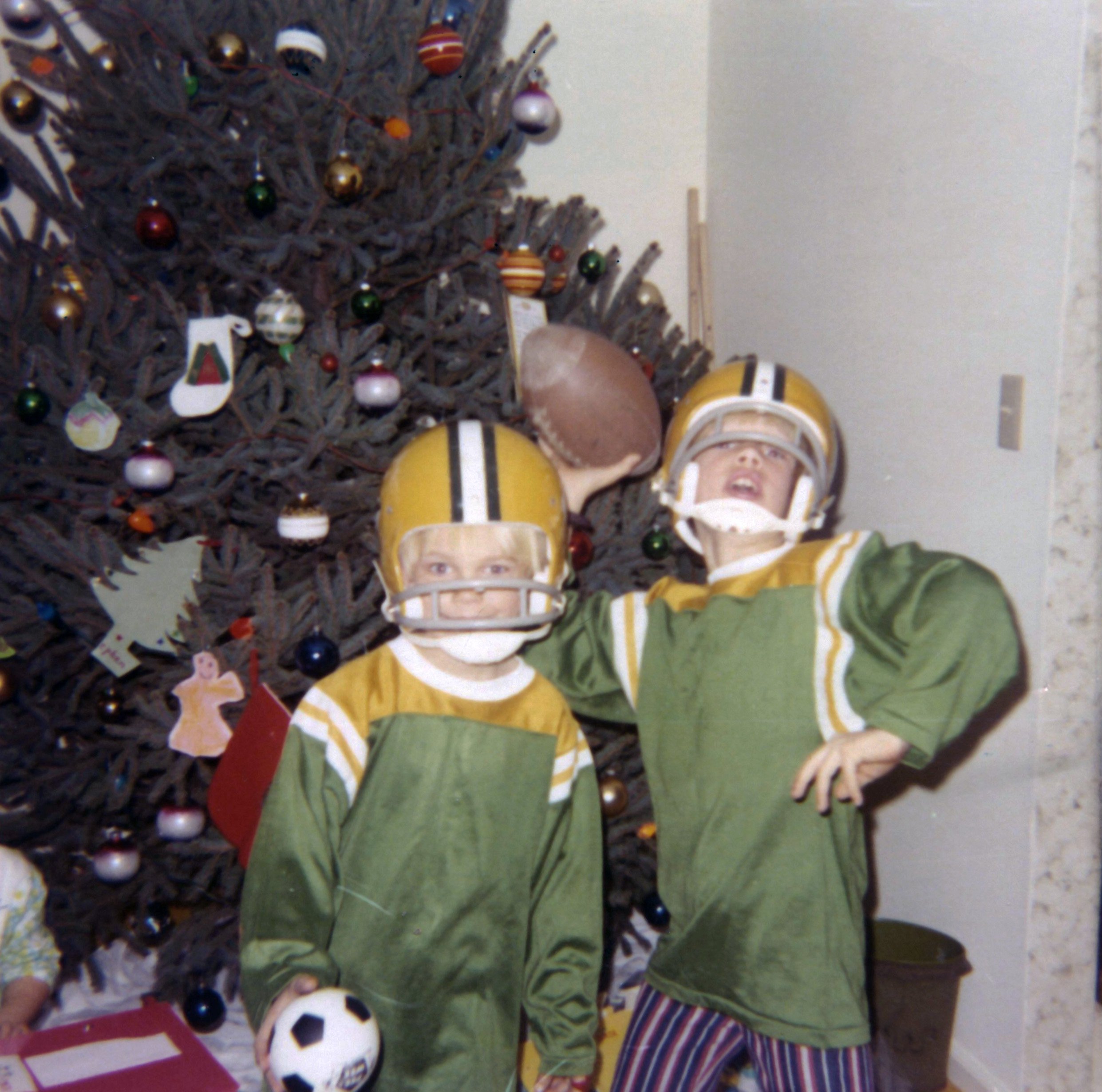 David and me with new Packers helmets and jerseys. Westport, CT, Christmas Day 1971