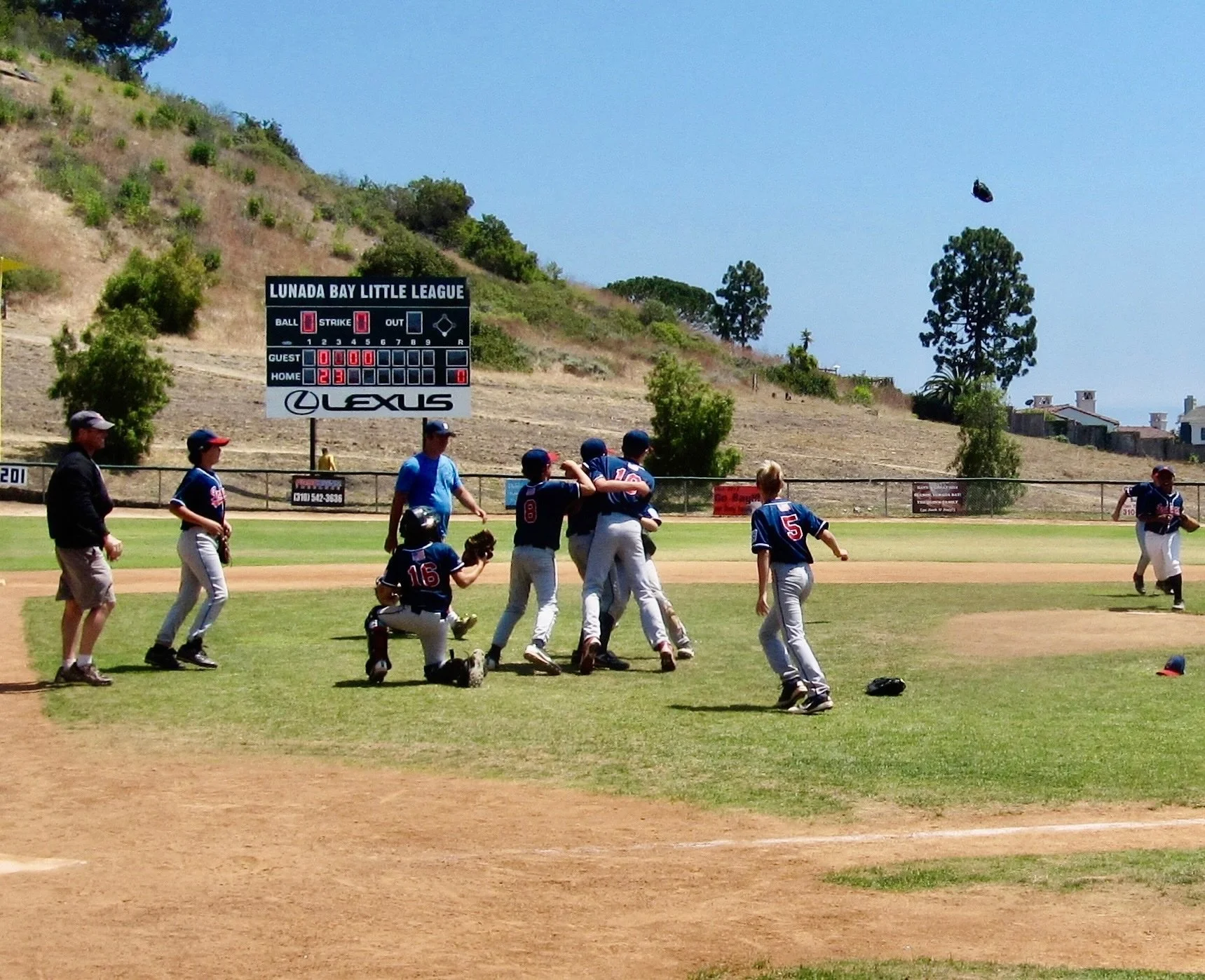 Finally, a championship; Indians celebrate 10-0 shutout. My son, Kevin, in foreground (#5); me to the far left. Lunada Bay Little League Field, Palos Verdes Estates, CA, May 2012