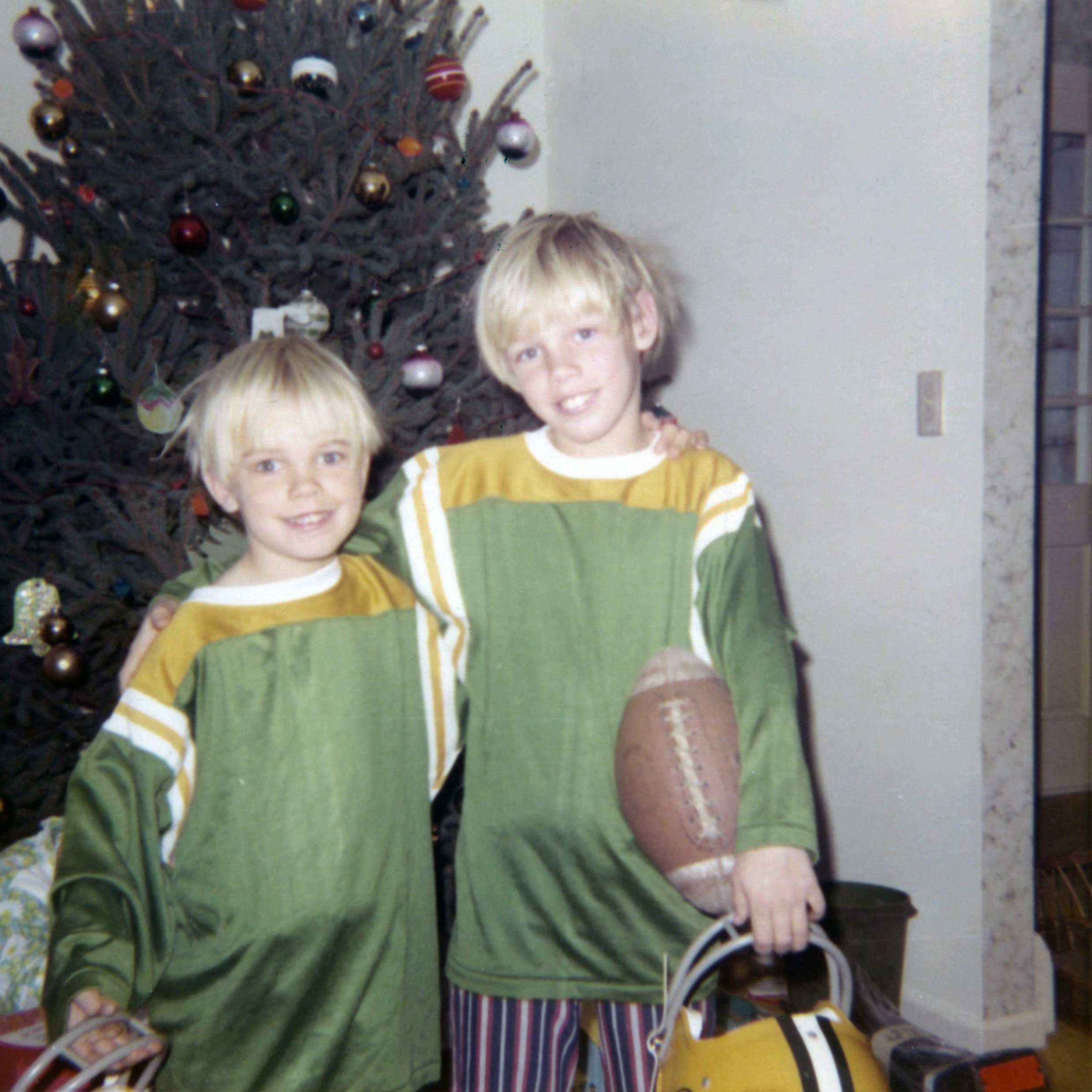 David and me with new Packers helmets and jerseys. Westport, CT, Christmas Day 1971