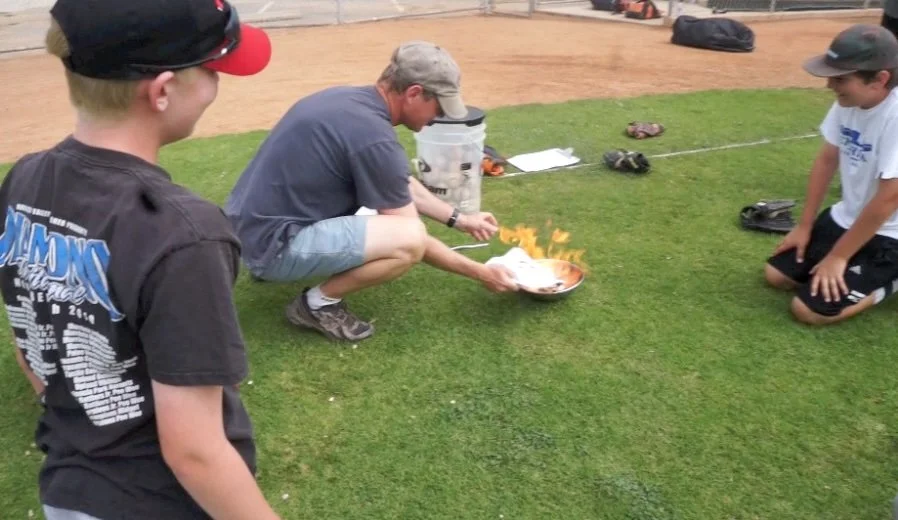 Ceremonial burning of the record. Colin Palmer (foreground), me (kneeling over flames), and Hayden Gunson. Lunada Bay Little League Field, Palos Verdes Estates, CA, May 2013