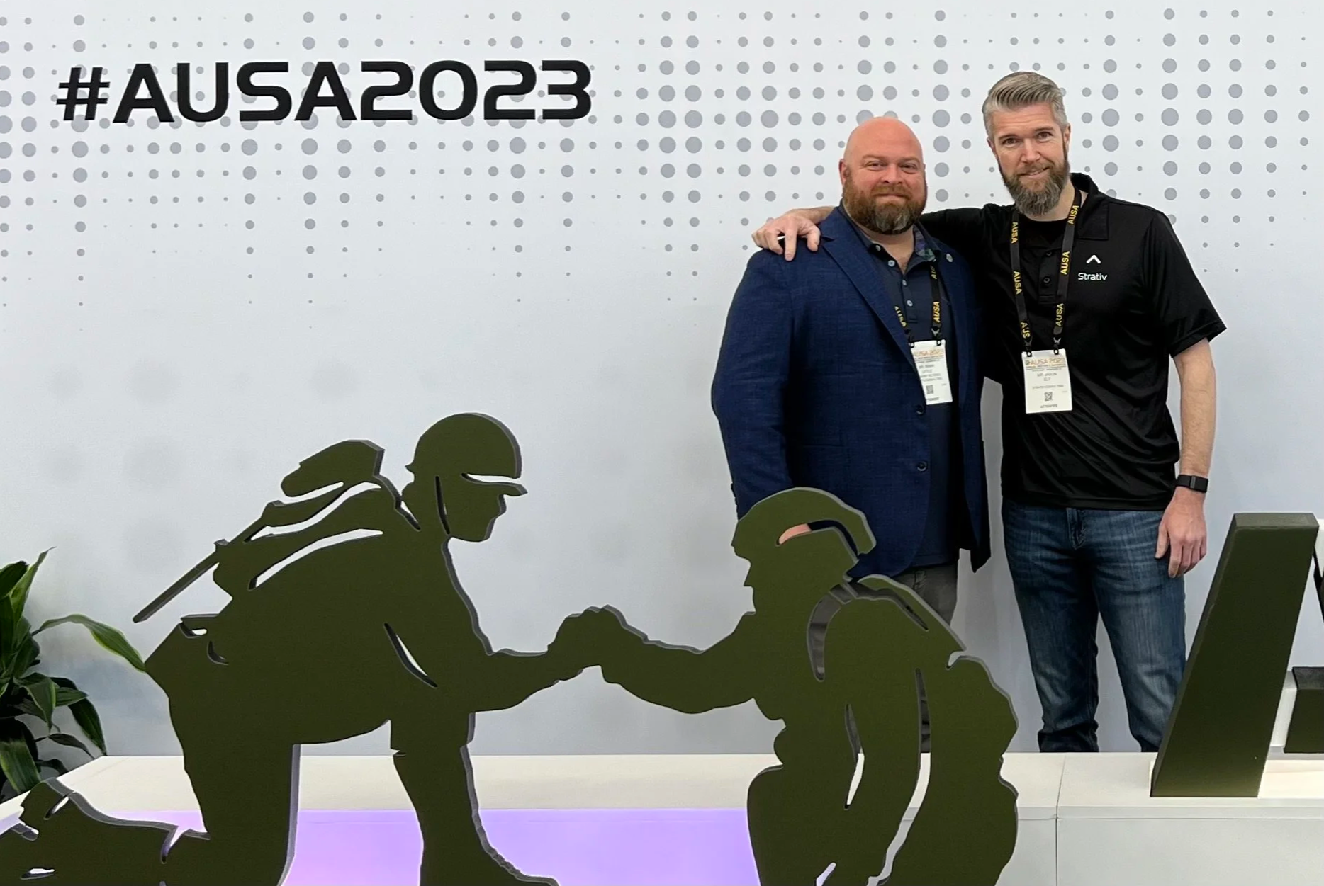 Strativ Consulting co-founders Mark Little and Jason Ely at the 2023 AUSA Annual Meeting, reflecting the firm’s leadership, service, and federal mission focus.