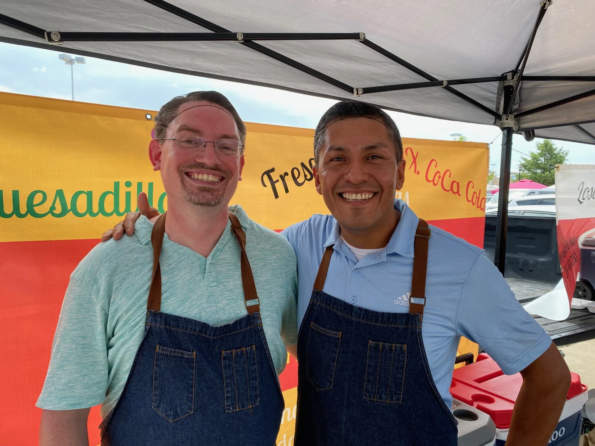 Justin and Santiago connecting with the community at a local event.