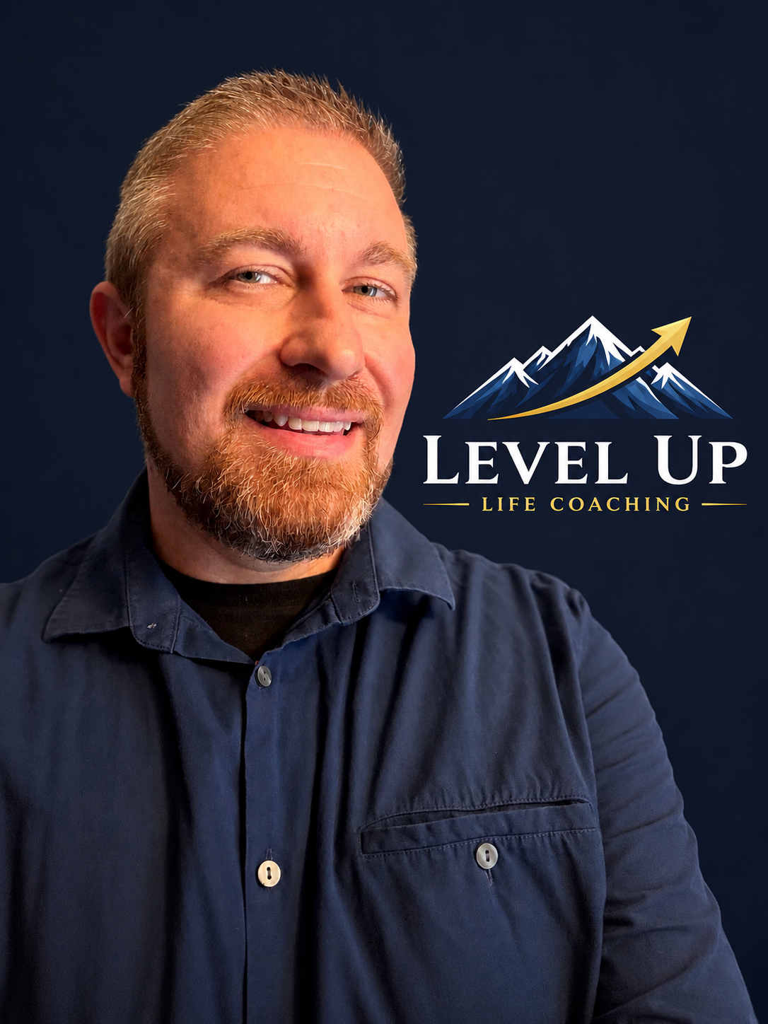 A man with a red beard and short hair smiling in front of a dark background, with a logo that reads 'Level Up Life Coaching' featuring a mountain and an upward arrow.