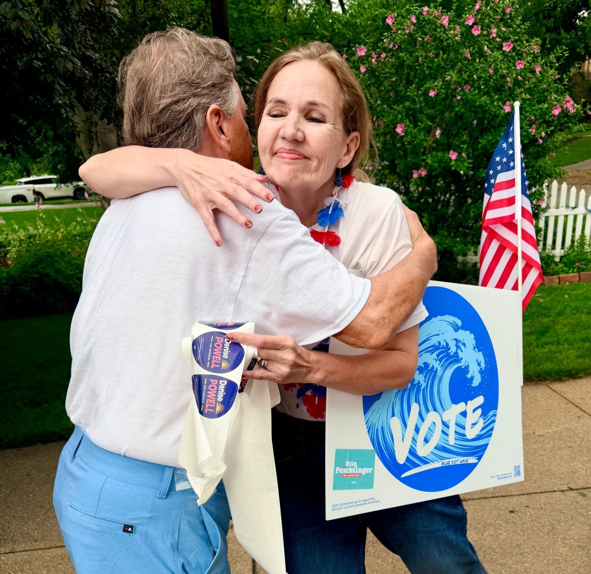 blue-dot-wave-denise-powell-parade-supporter-hug-vote-sign-02.jpg