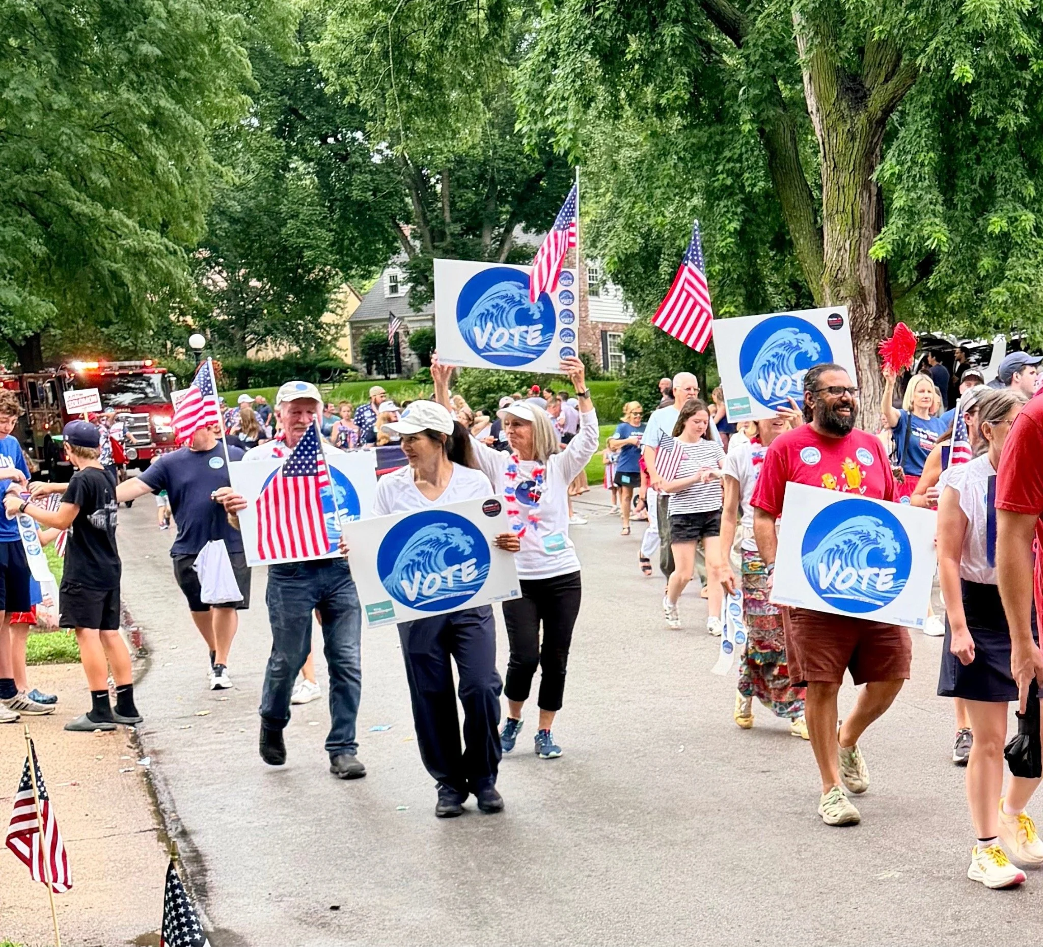blue-dot-wave-fourth-of-july-parade-vote-signs-american-flags-20.jpg