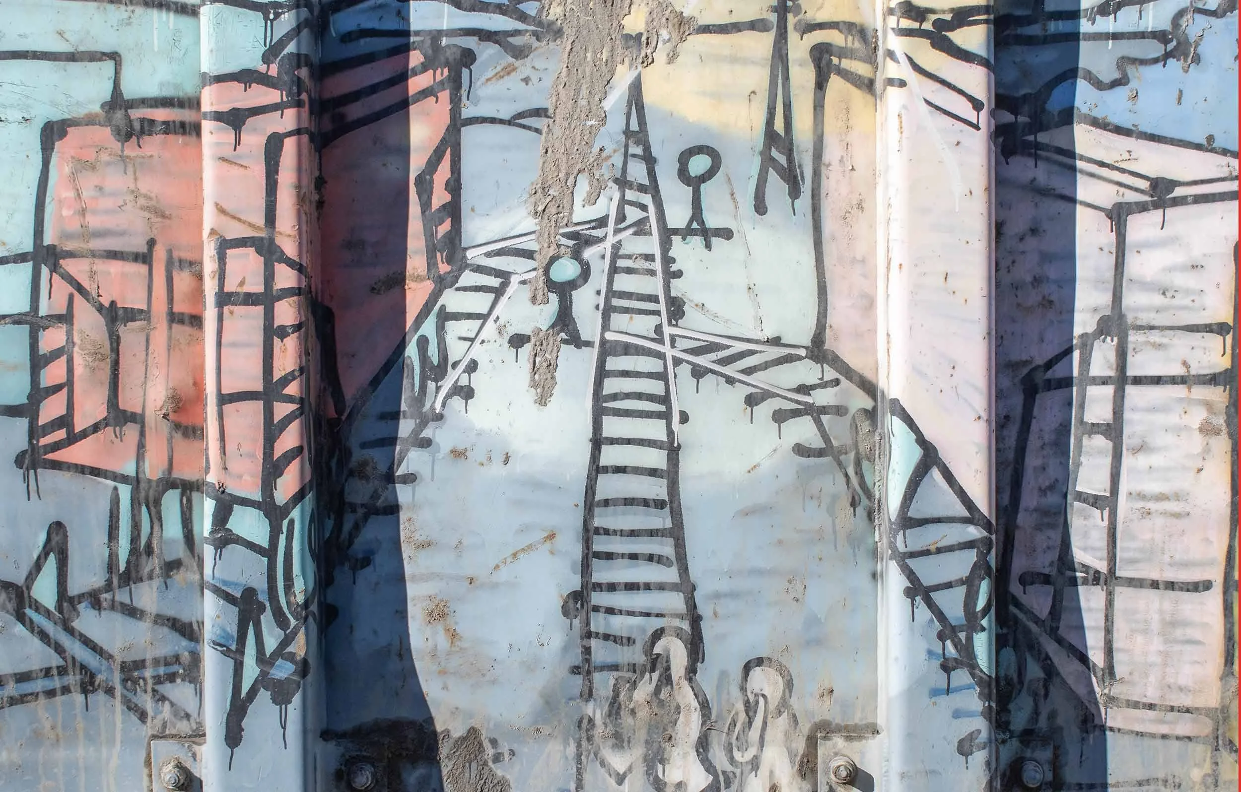 Graffiti art on a weathered metal surface with a light blue background, featuring black line drawings of industrial structures and railway tracks.