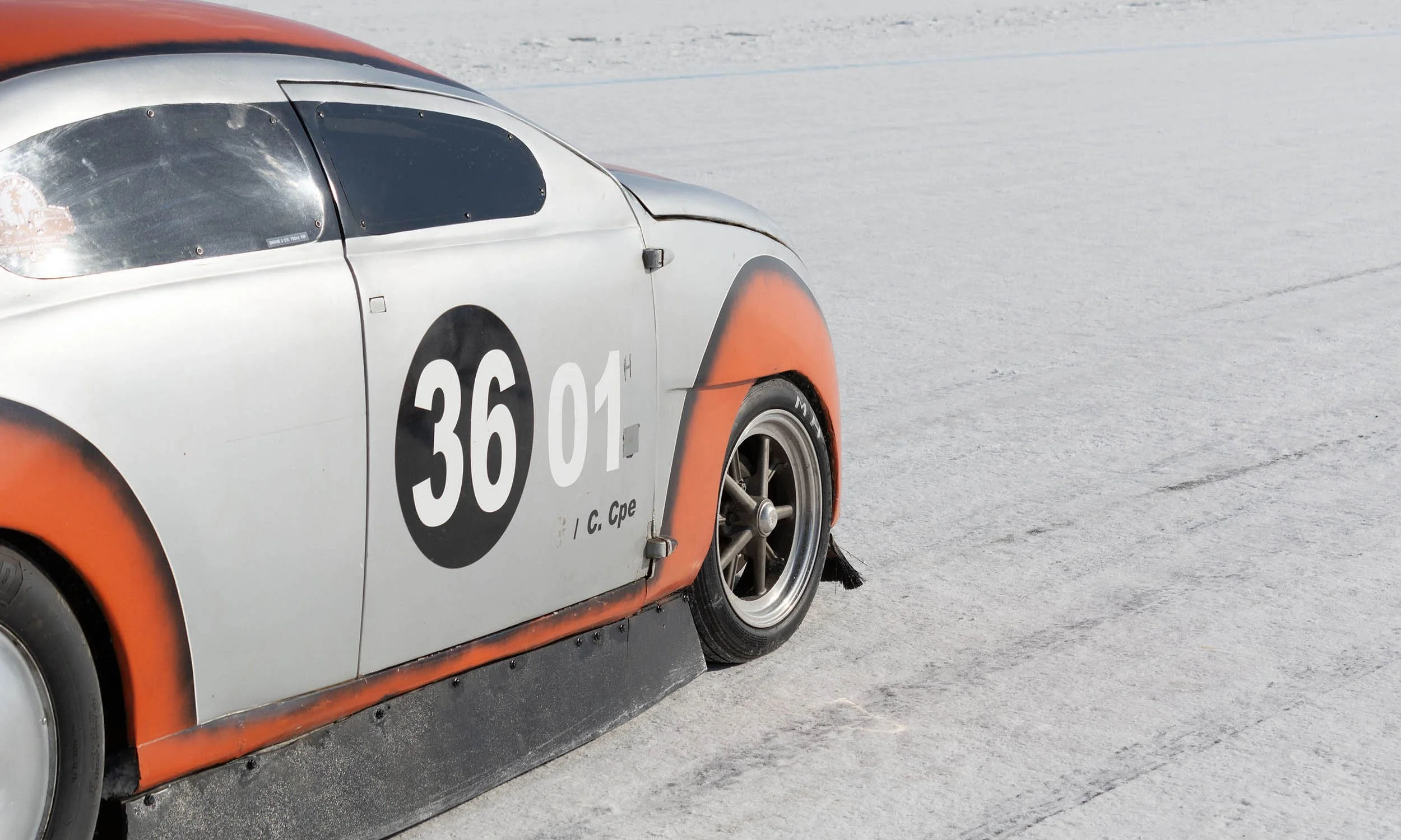Close-up VW mod on salt flat. Custom chop