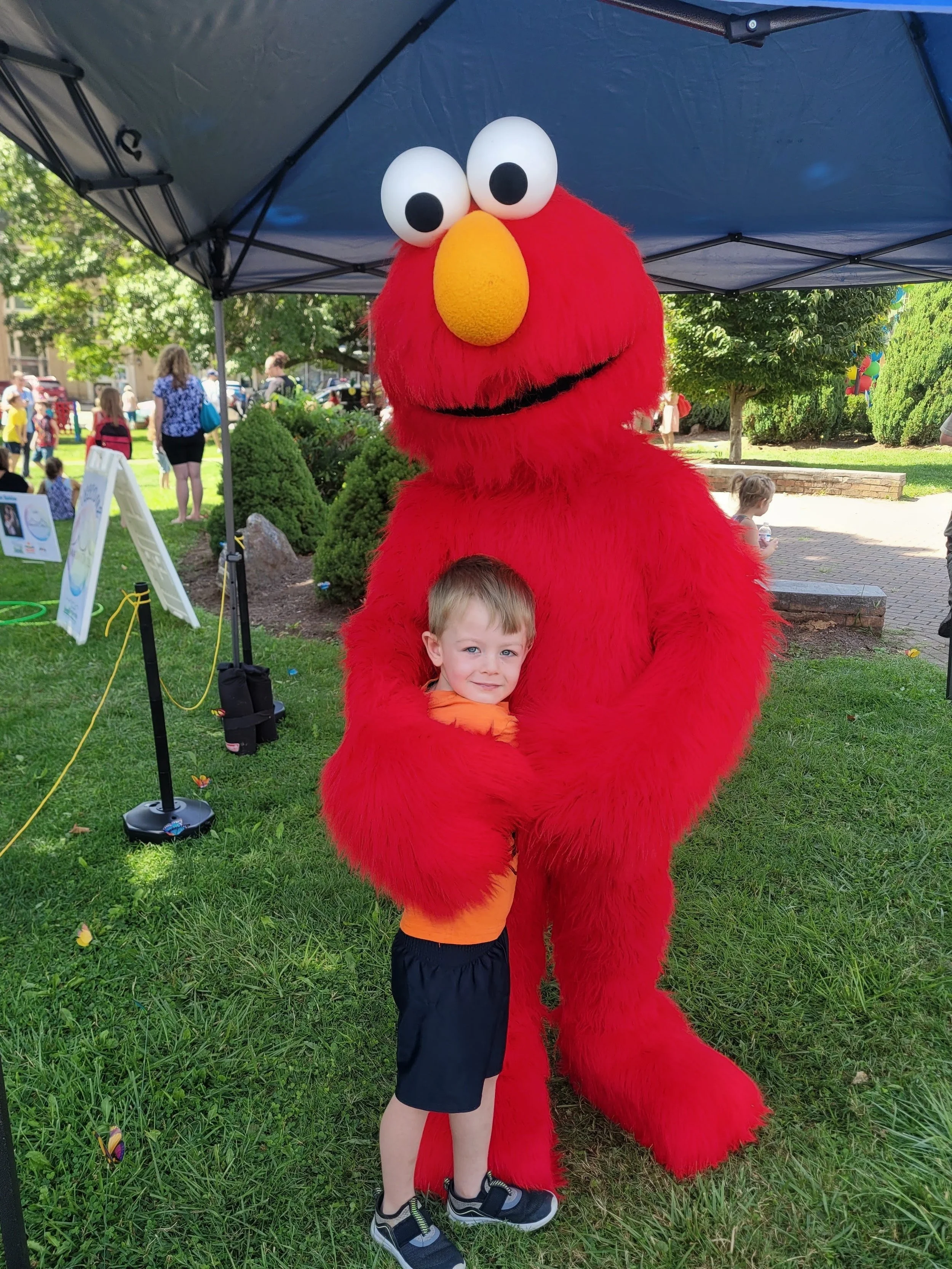 Biddix Kid with Elmo at a Blue Ridge Partnership for Children event, Sizzling Summer. 2023
