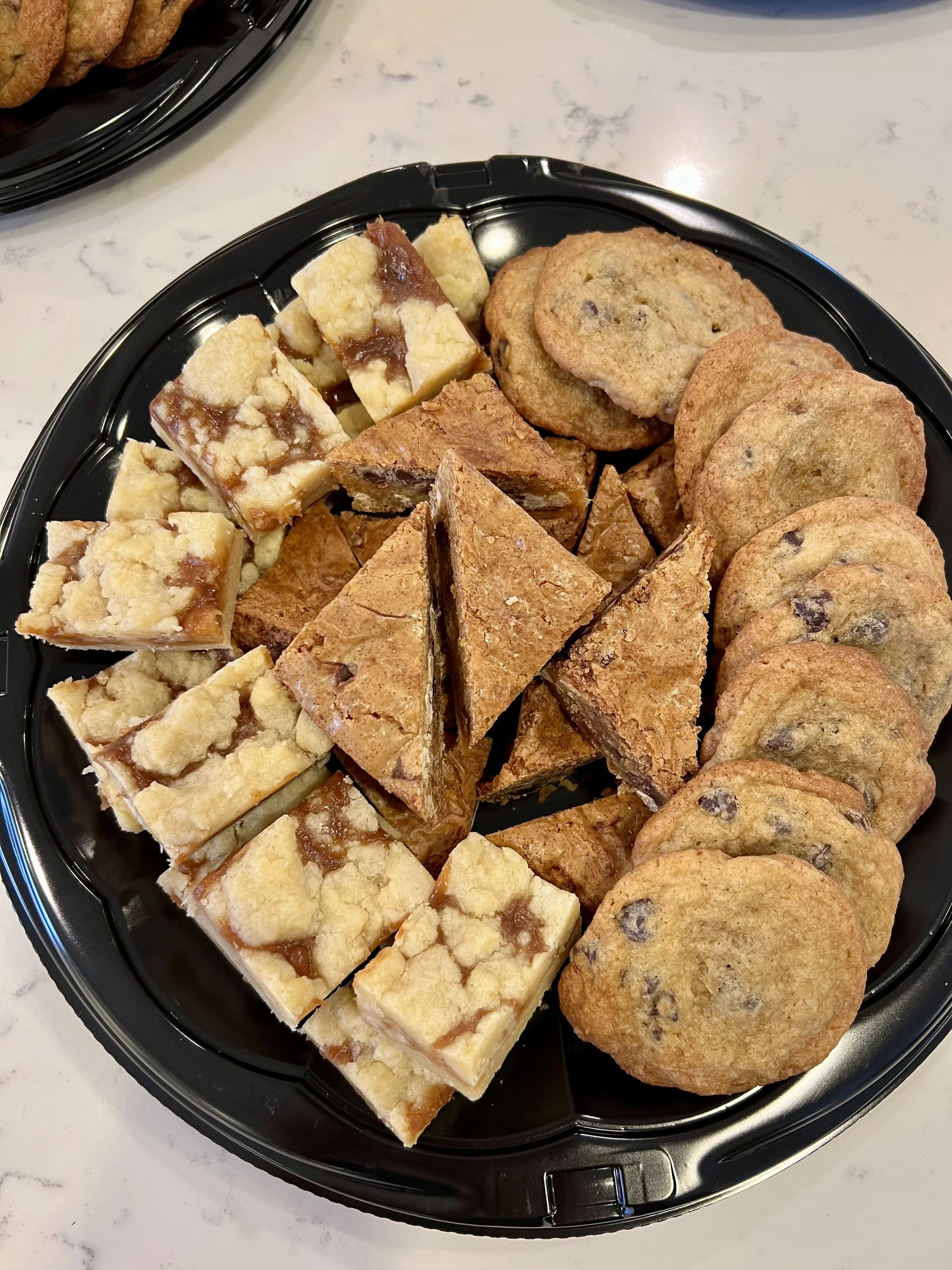 Dessert platter with chocolate chip cookies, blondies and salted caramel bars