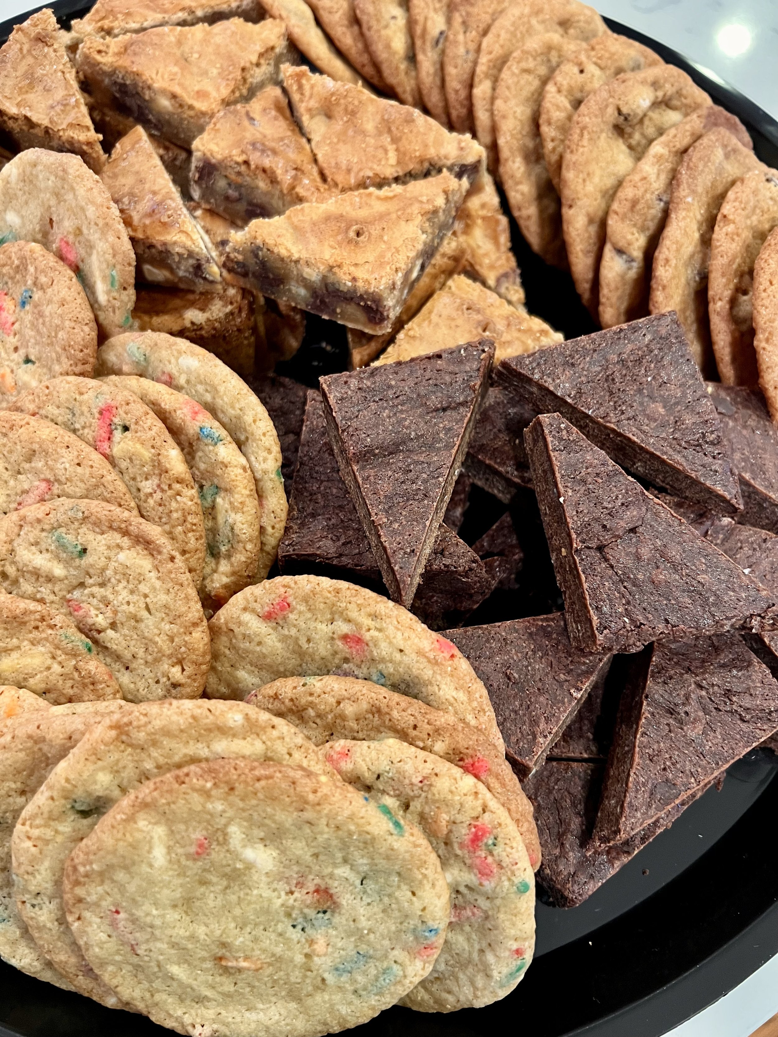 Dessert platter with fudgy caramel brownies, vanilla bean sprinkle cookies, blondies and chocolate chip cookies