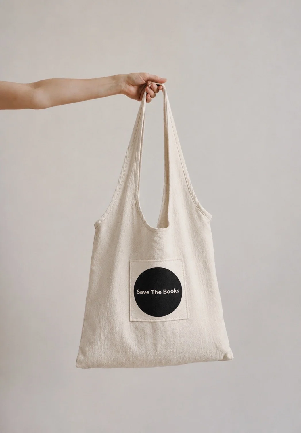 Save The Books reusable tote bag supporting book rescue, literacy, and the movement to keep books in circulation.