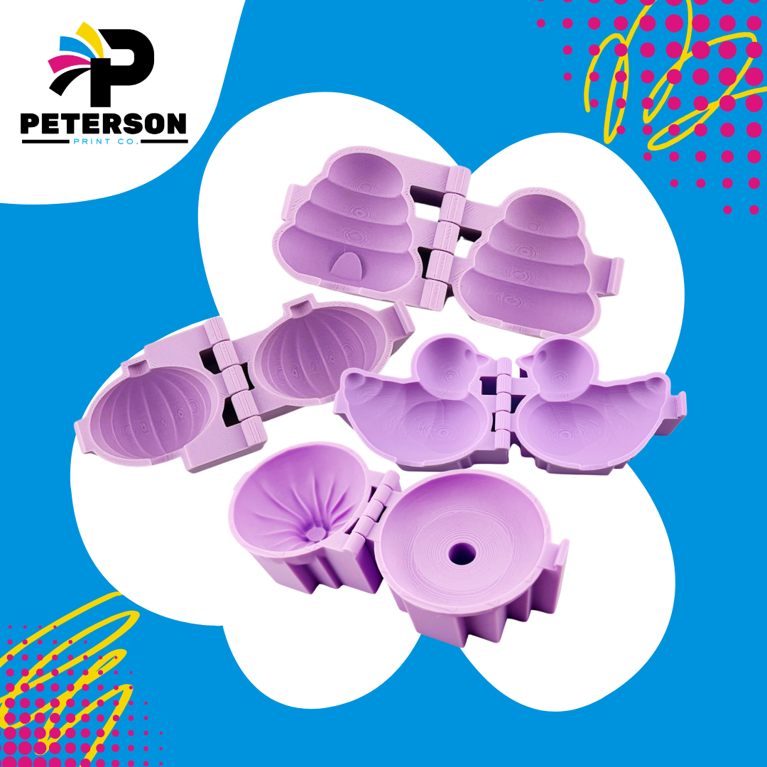 Set of purple silicone molds designed to resemble seashells.