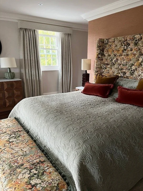 bed with oversize upholstered headboard 