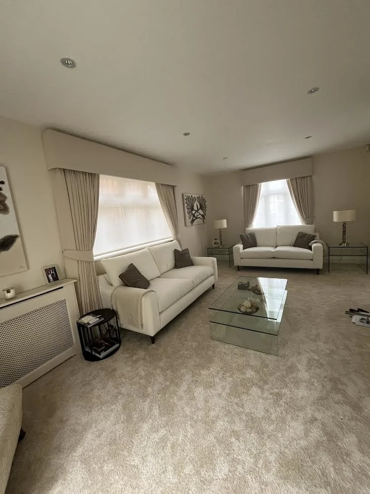 Living room finished image cream curtains, pelmets and reupholstered sofas