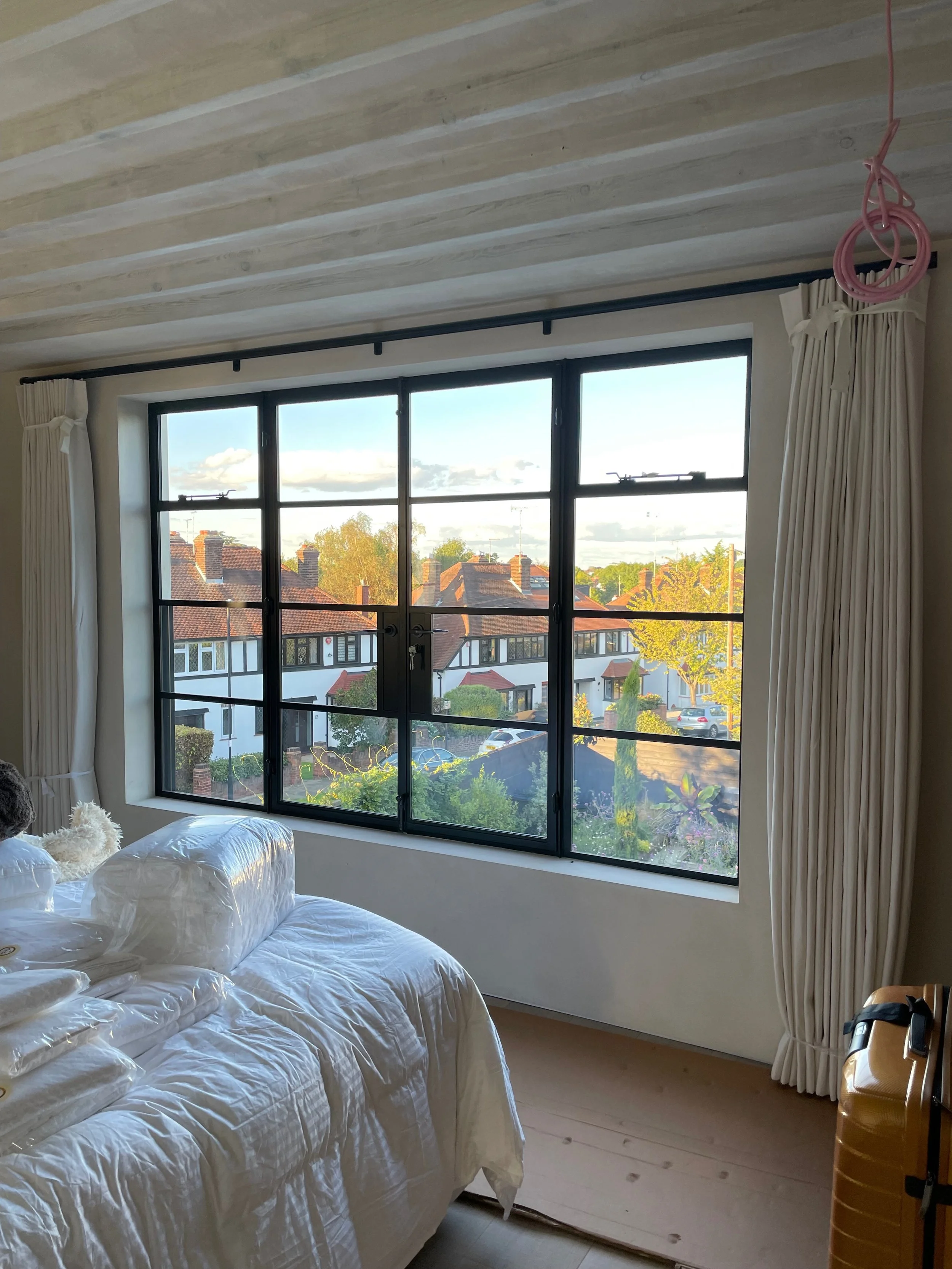 bedroom with curtains installed