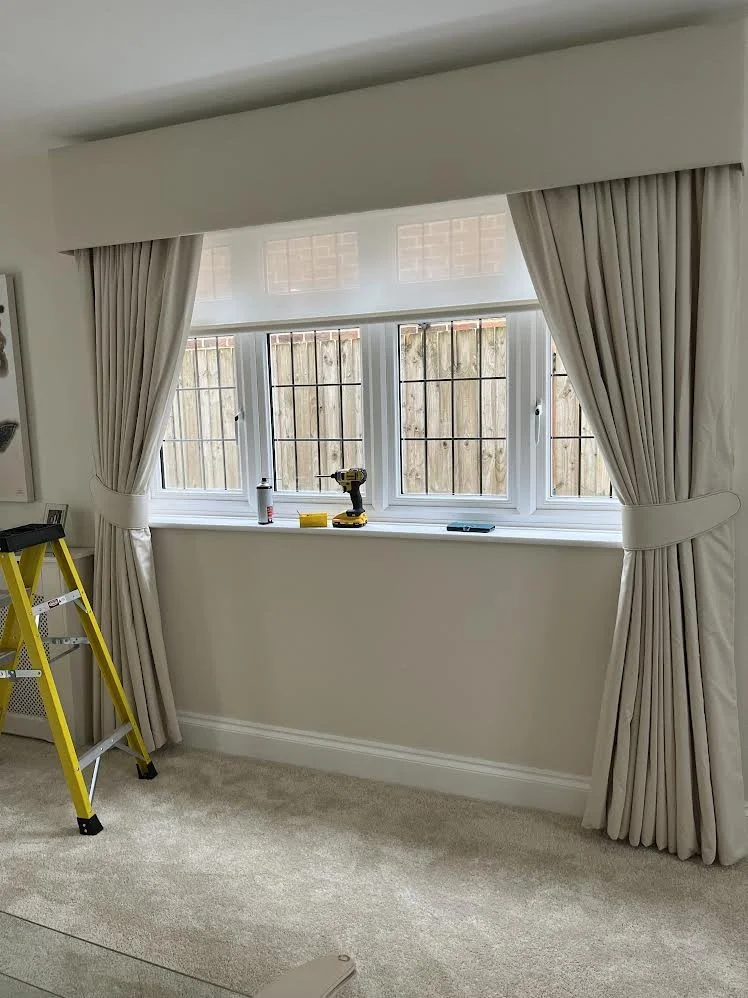 living room curtains, voile roller blind and pelmet on fitting day with ladder